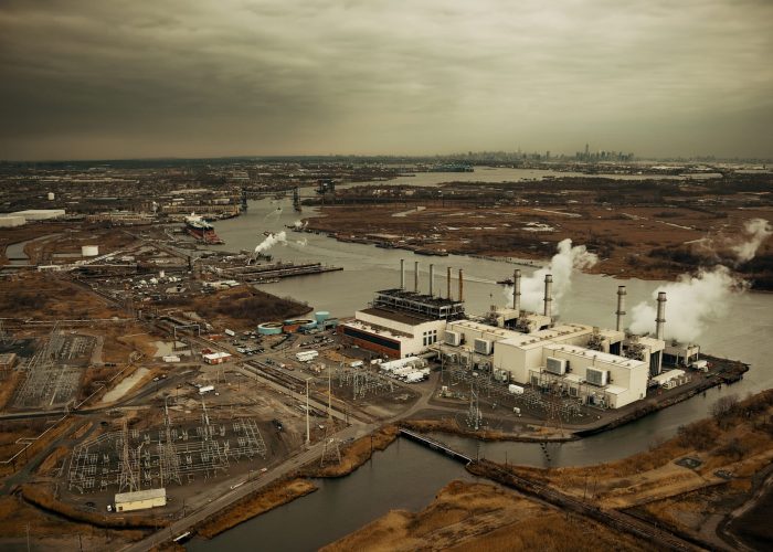 new-jersey-oil-industry-with-new-york-city-skyline-from-afar-aerial-view-min